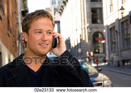 Casually dressed businessman talking on cellular PDA. View Large Photo Image Stock Image - Casually dressed businessman talking on cellular PDA.. Fotosearch