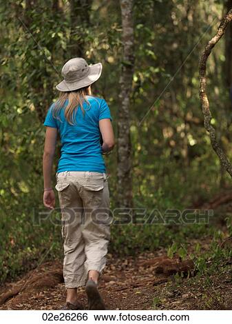 Stock Photograph - Caucasian girl hiking in Kenya Africa. Fotosearch