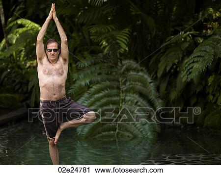Caucasian man doing yoga in Bali View Large Photo Image Stock Image - Caucasian man doing yoga in Bali. Fotosearch