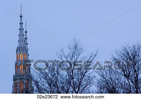 Church spire rising above leafless trees. View Large Photo Image Stock Image - Church spire rising above leafless trees.. Fotosearch