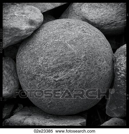 Circular rock surrounded by other rocks. View Large Photo Image Stock Photography - Circular rock surrounded by other rocks.. Fotosearch