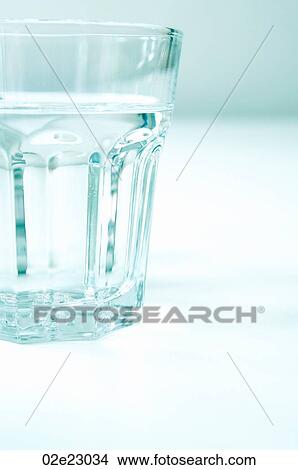 Clear glass tumbler of water. View Large Photo Image Picture - Clear glass tumbler of water.. Fotosearch