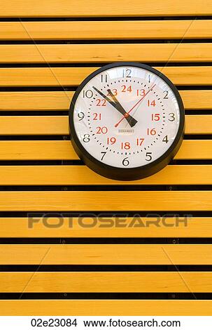 Clock on wood slatted wall. View Large Photo Image Picture - Clock on wood slatted wall.. Fotosearch