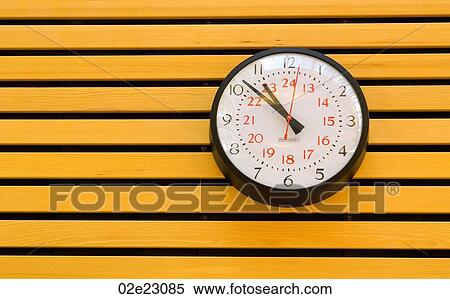Clock on wooden slatted wall. View Large Photo Image Stock Photography - Clock on wooden slatted wall.. Fotosearch