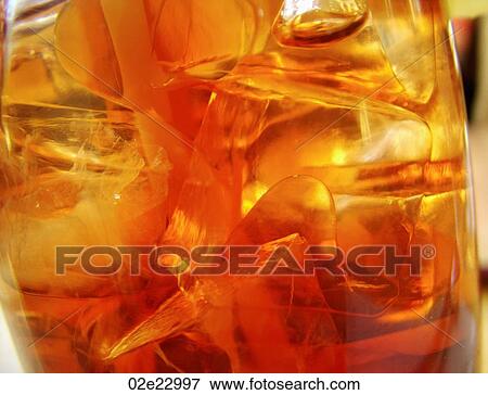 Stock Photo - Close-up detail of ice in refreshing cola drink.. Fotosearch