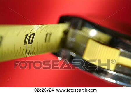 Close-up of 10 inch marking on tape measure. View Large Photo Image Picture - Close-up of 10 inch marking on tape measure.. Fotosearch