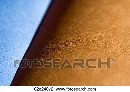 Stock Image - Close-up of brown and blue paper.. Fotosearch