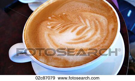 Close-up of cappuccino in cafe. View Large Photo Image Stock Photo - Close-up of cappuccino in cafe.. Fotosearch