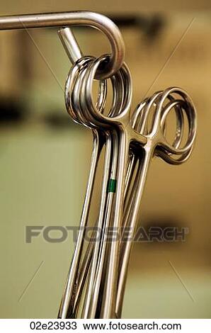 Close-up of hanging scissor clamps. View Large Photo Image Stock Image - Close-up of hanging scissor clamps.. Fotosearch