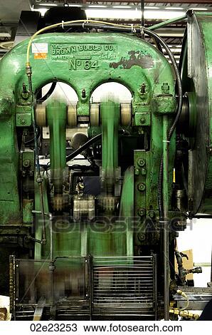 Stock Image - Close up of industrial factory machine working.. Fotosearch