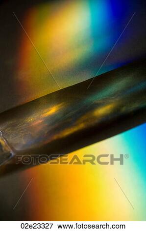 Close-up of light refracting through prism. View Large Photo Image Stock Photo - Close-up of light refracting through prism.. Fotosearch