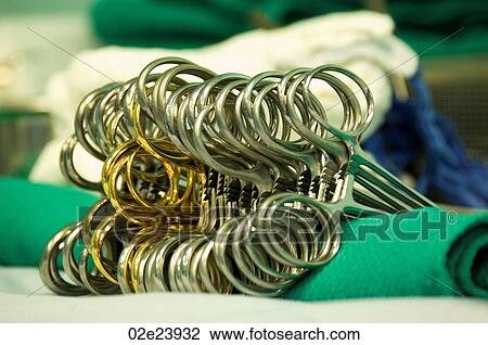 Stock Image - close-up of surgical scissor clamps.. Fotosearch