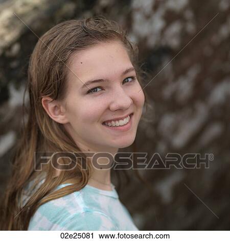 Stock Image - Close up of teenage girl smiling. . Fotosearch