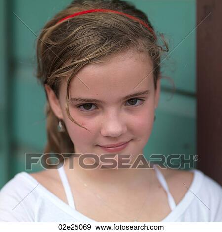 Stock Photo - Close up of young girl smiling. . Fotosearch