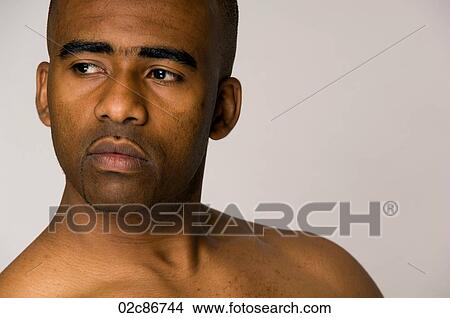 Close-up portrait of strong African-American man. View Large Photo Image Picture - Close-up portrait of strong African-American man.. Fotosearch