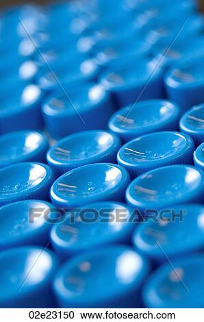 Stock Image - Close-up view of lab container tops.. Fotosearch