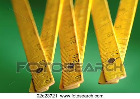 Collapsible wooden measuring stick with numbers. View Large Photo Image Stock Image - Collapsible wooden measuring stick with numbers.. Fotosearch