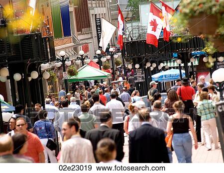 Crowded downtown sidewalk in the summer. View Large Photo Image Stock Photo - Crowded downtown sidewalk in the summer.. Fotosearch