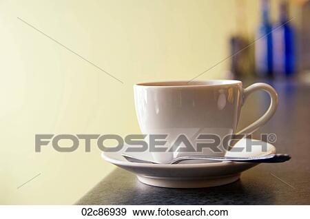 Cup and saucer of coffee on European cafe counter. View Large Photo Image Stock Photo - Cup and saucer of coffee on European cafe counter.. Fotosearch