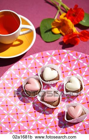 Stock Image - Cup cakes on a table. Fotosearch