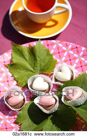 Stock Image - Cup cakes on a table. Fotosearch