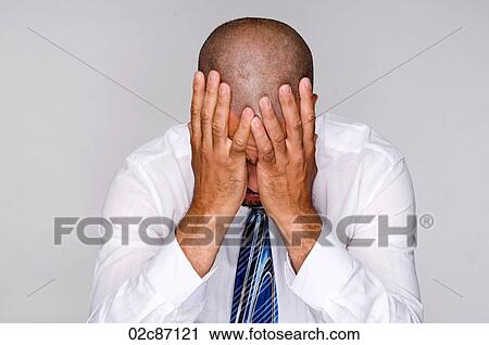 Depressed businessman holding head with hands. View Large Photo Image Stock Image - Depressed businessman holding head with hands.. Fotosearch