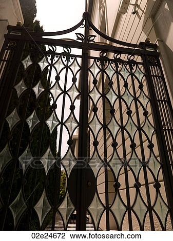 Stock Image - Diamond shape glass on a gate in Athens Greece. Fotosearch