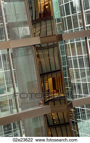 Stock Image - Distorted reflection of office building.. Fotosearch