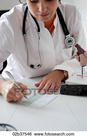 Stock Photograph - Doctor writing a prescription. Fotosearch