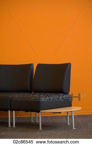 Empty chairs against a bright orange wall. View Large Photo Image Stock Photography - Empty chairs against a bright orange wall.. Fotosearch
