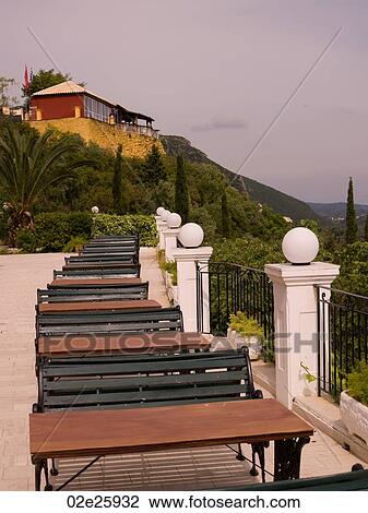 Empty tables and benches in Corfu View Large Photo Image Stock Image - Empty tables and benches in Corfu. Fotosearch
