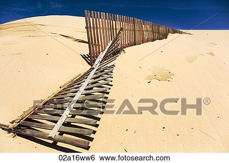Fallen fence on windswept Tarifa beach, Cadiz, Andalusia, Spain View Large Photo Image Stock Photograph - Fallen fence on windswept Tarifa beach, Cadiz, Andalusia, Spain. Fotosearch