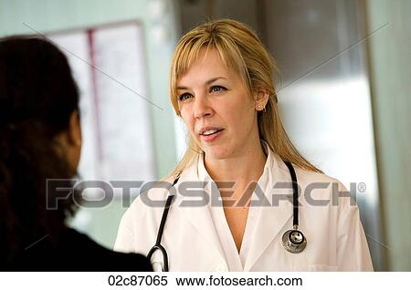 Female doctor talking to patient in hospital. View Large Photo Image Stock Photography - Female doctor talking to patient in hospital.. Fotosearch