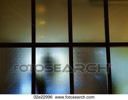 Figures hidden behind frosted glass. View Large Photo Image Stock Photograph - Figures hidden behind frosted glass.. Fotosearch