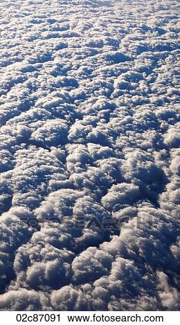 Fluffy clouds from above. View Large Photo Image Stock Image - Fluffy clouds from above.. Fotosearch