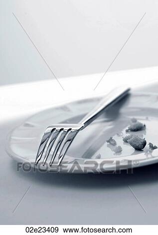 Fork and crumbs left on plate. View Large Photo Image Stock Photo - Fork and crumbs left on plate.. Fotosearch