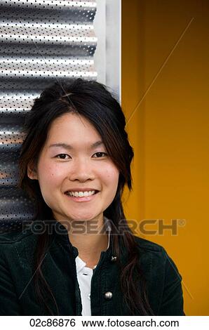Stock Photograph - Friendly Asian college student.. Fotosearch