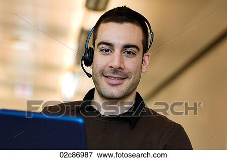 Stock Photo - Friendly call center employee.. Fotosearch