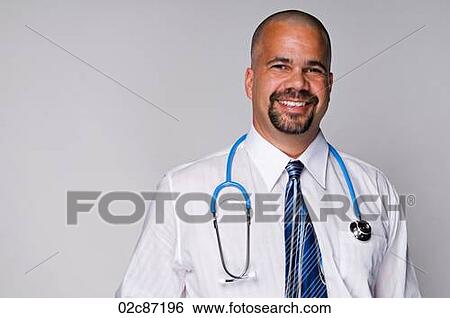 Stock Photograph - Friendly family doctor with stethoscope on white background.. Fotosearch