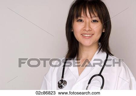 Friendly female Asian family doctor. View Large Photo Image Stock Image - Friendly female Asian family doctor.. Fotosearch