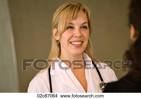 Friendly female family doctor. View Large Photo Image Picture - Friendly female family doctor.. Fotosearch