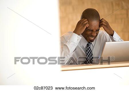 Stock Image - Frustrated African-american businessman.. Fotosearch