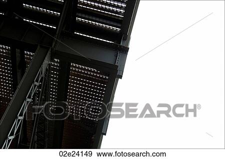 Stock Photo - Girder and framing structure of the underside of a metal bridge.. Fotosearch