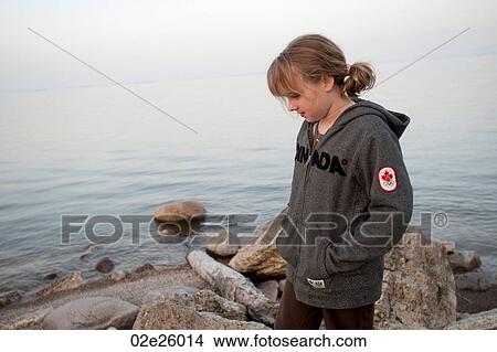 Girl along the shoreline in Gimli, Manitoba, Canada View Large Photo Image Picture - Girl along the shoreline in Gimli, Manitoba, Canada. Fotosearch