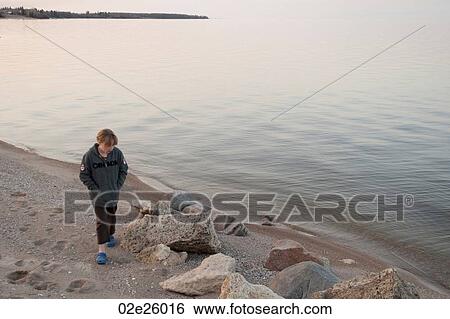 Girl along the shoreline in Gimli, Manitoba, Canada View Large Photo Image Stock Photograph - Girl along the shoreline in Gimli, Manitoba, Canada. Fotosearch