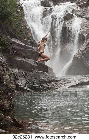 Girl jumping from cliff at Mountain Pine Ridge Reserve, Waterfall View Large Photo Image Stock Image - Girl jumping from cliff at Mountain Pine Ridge Reserve, Waterfall. Fotosearch