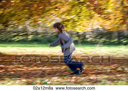Girl running in a park View Large Photo Image Stock Image - Girl running in a park. Fotosearch