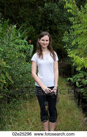 Girl standing in forest at Mountain Pine Ridge Reserve View Large Photo Image Stock Photograph - Girl standing in forest at Mountain Pine Ridge Reserve. Fotosearch