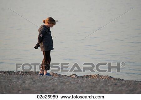 Girl standing on the beach at Gimli, Manitoba, Canada View Large Photo Image Stock Photo - Girl standing on the beach at Gimli, Manitoba, Canada. Fotosearch