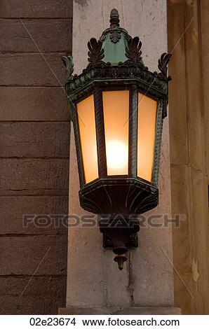 Glowing light on an exterior wall. View Large Photo Image Picture - Glowing light on an exterior wall.. Fotosearch